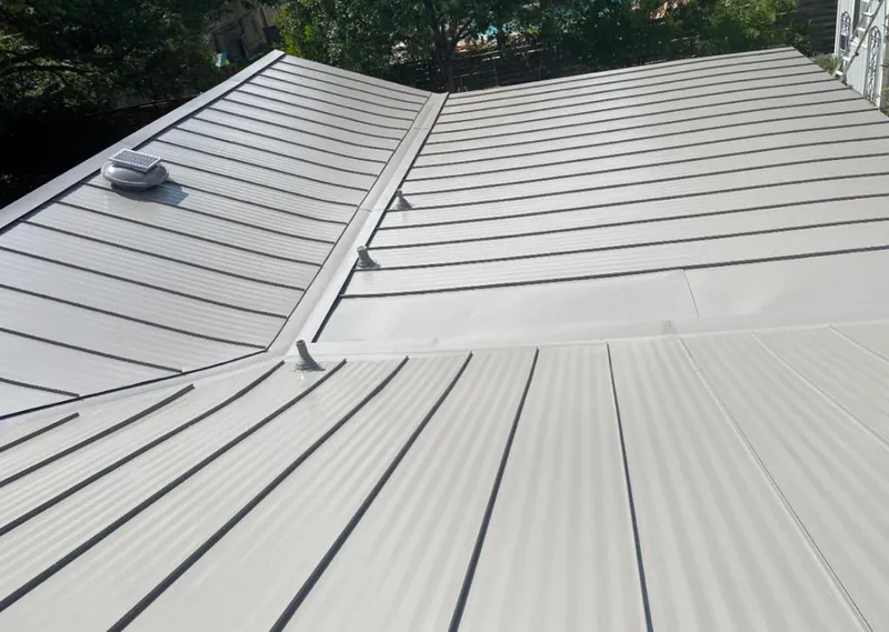 Solar attic fan installed on a metal roof for Roof Ventilation in Bel Air